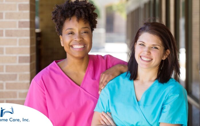 2 smiling women in scrubs represent RN supervisors and the good environment that can be promoted when they work together with caregivers for quality client care.