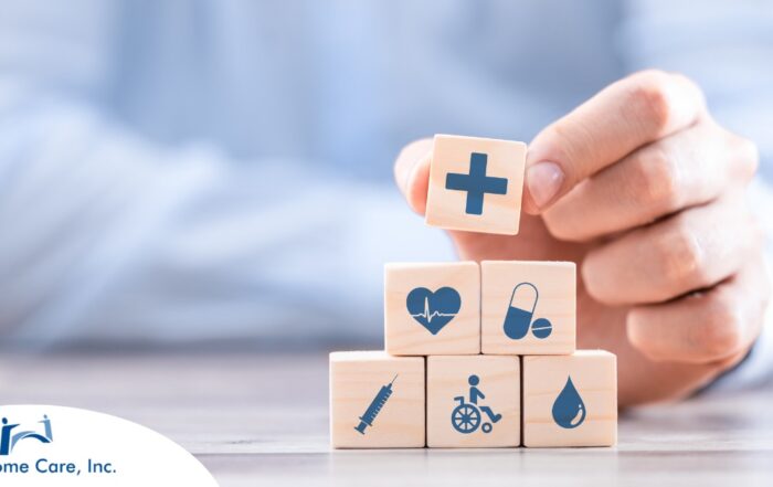 A stack of block with different health related icons represents health insurance which can help with home health care.