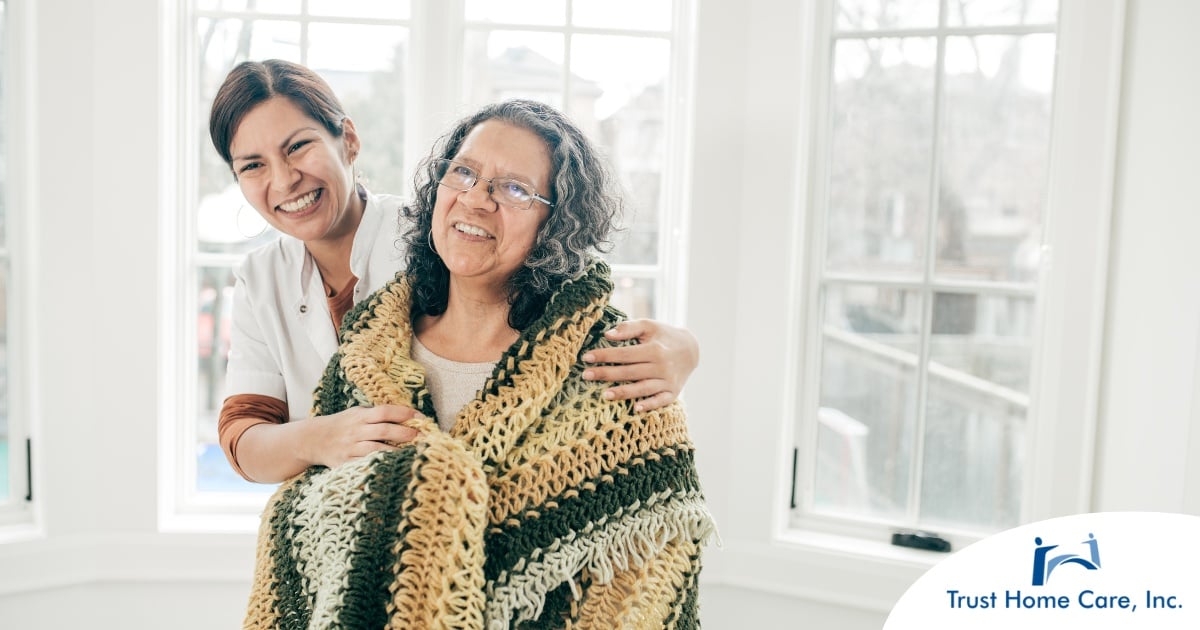 Establishing-Rapport-Essential-Strategies-for-Caregivers-with-New-Clients A caregiver hugs an older client representing the kind of good environment a caregiver has the potential to create with new clients.