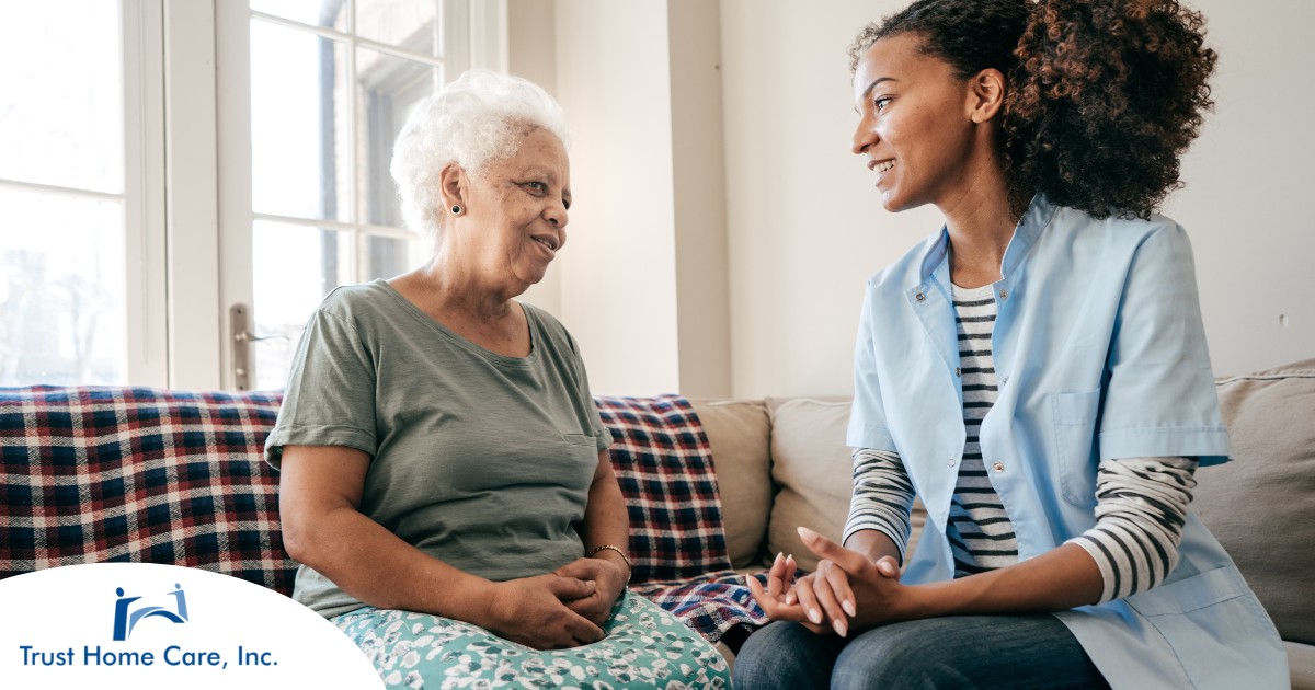 Non-Medical-Home-Care-What-It-Is-and-Why-It-Matters A caregiver sits and spends time with a client, representing how non-medical home care can benefit older loved ones.