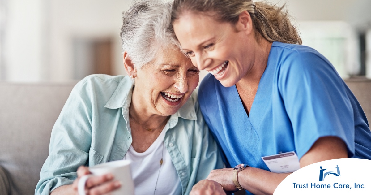 The-Heart-of-Caregiving-How-Social-Skills-Enhance-Professional-Caregivers-Impact A caregiver laughs with a client representing how good social skills can help professional caregivers.