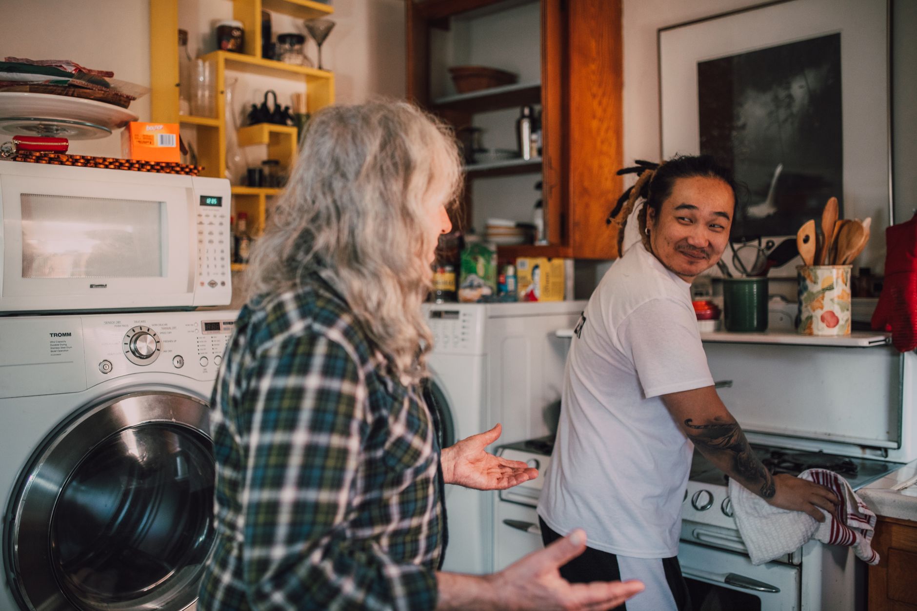 A caregiver sharing a warm moment with a senior in the kitchen during aged care in Sterling, VA