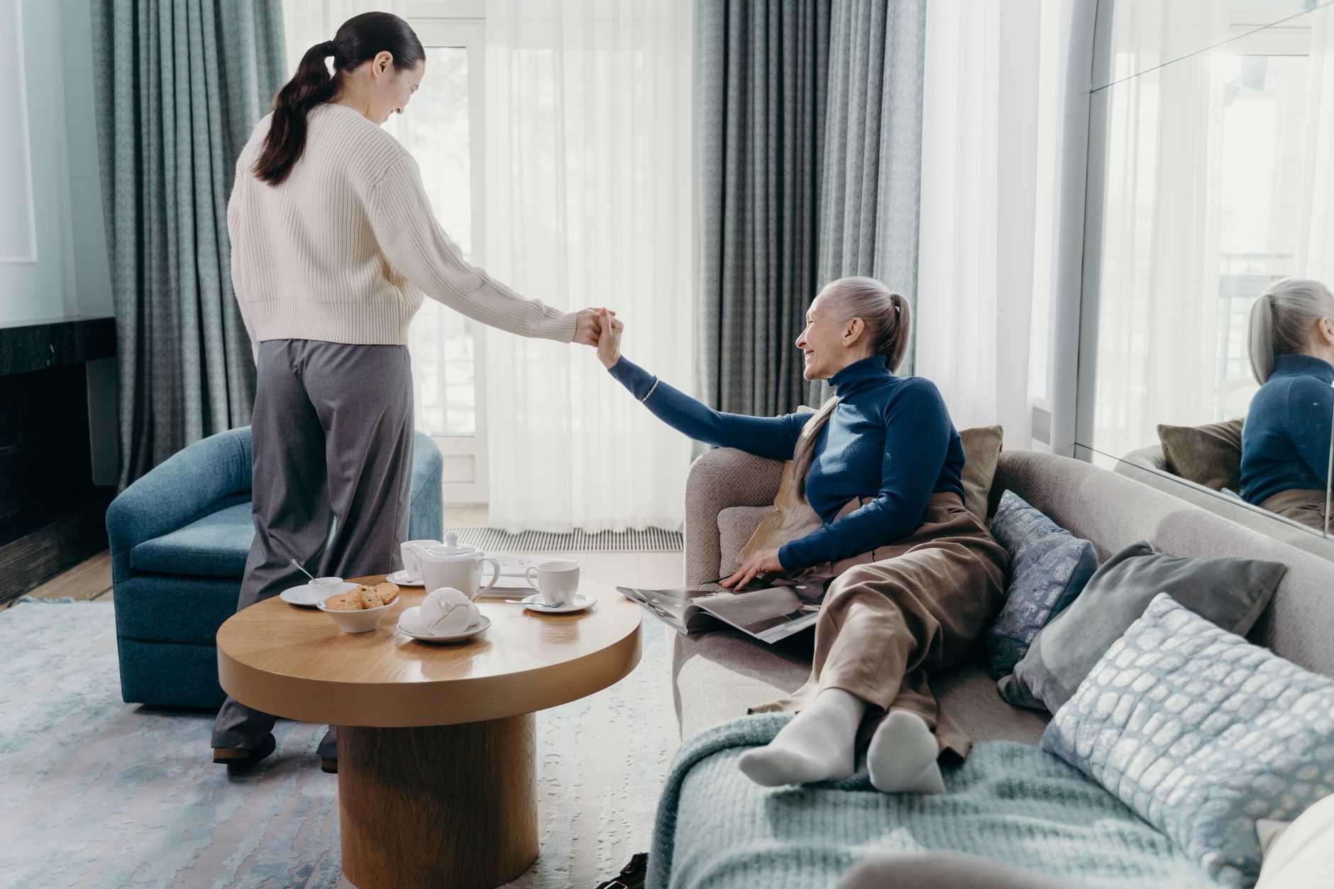 A caregiver providing steady, reassuring support to a senior at home during aged care in Sterling, VA