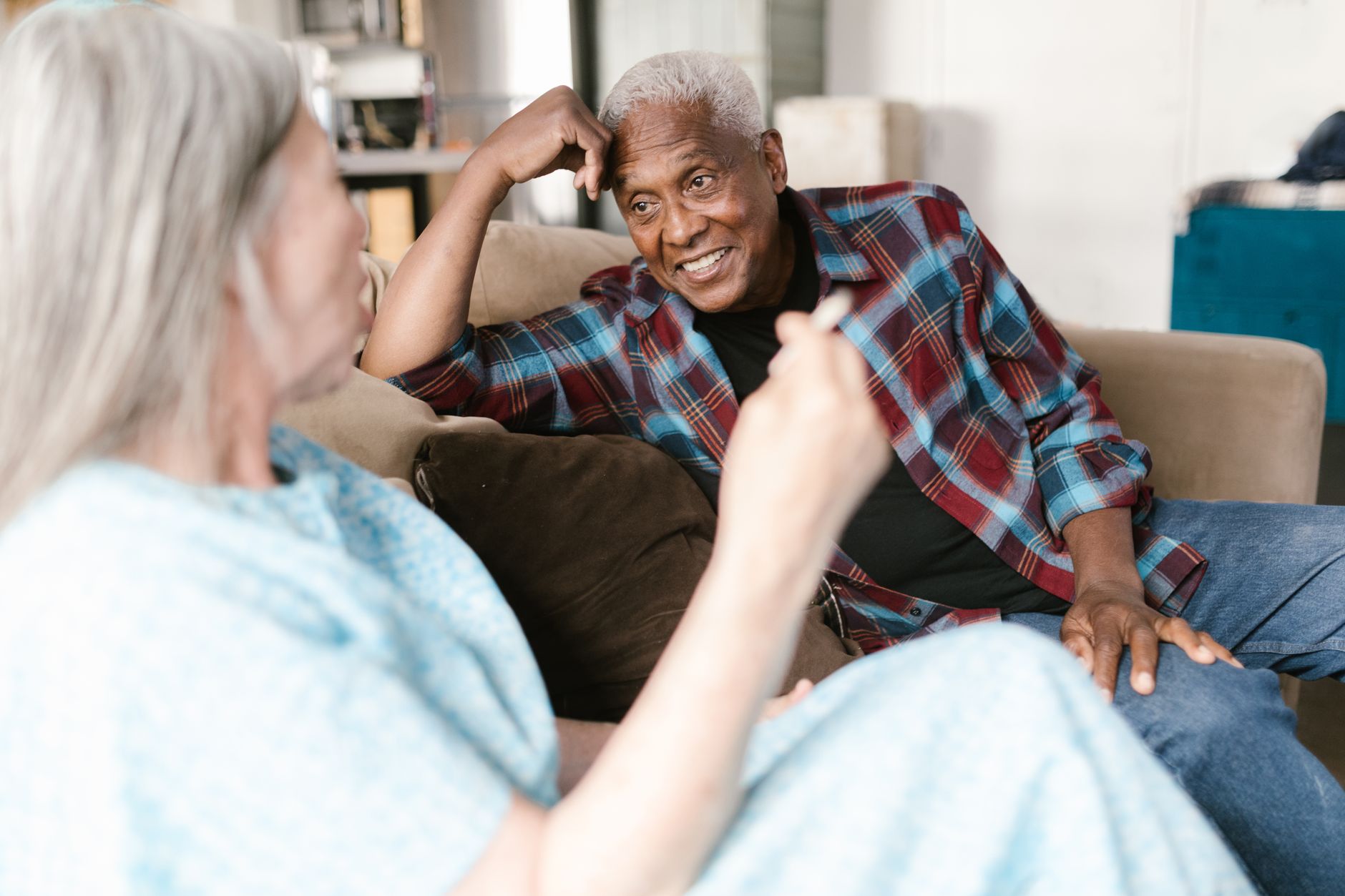 A senior enjoying a relaxed, friendly conversation with a companion caregiver in Sterling, VA