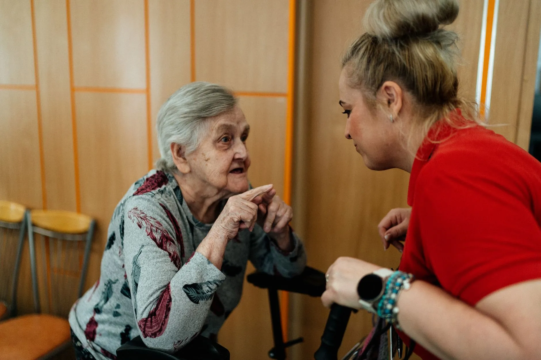 A home care caregiver offering steady support to a senior woman in Sterling, VA