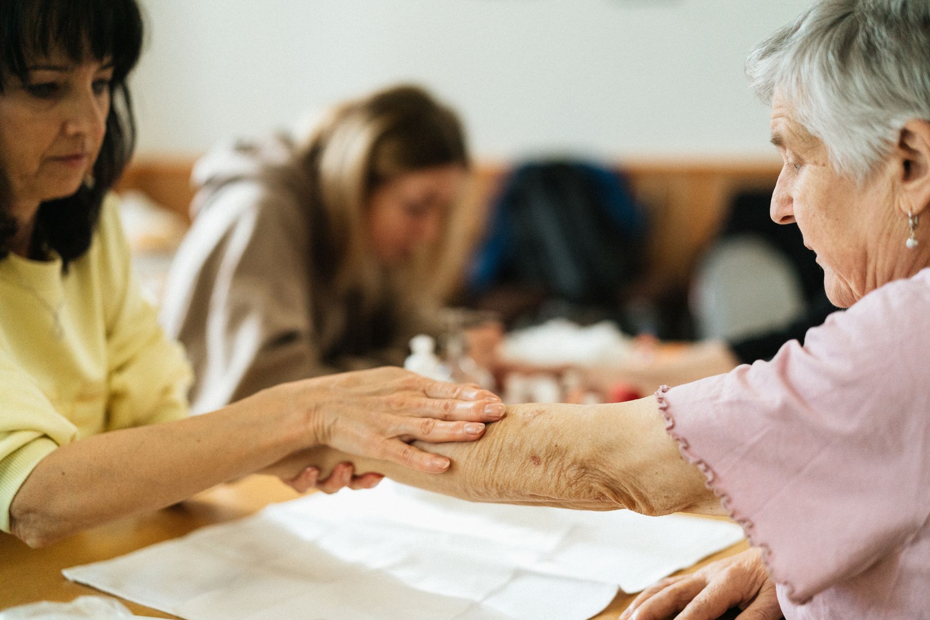 An occupational therapist offering warm, hands-on support to a senior at home in Sterling, VA