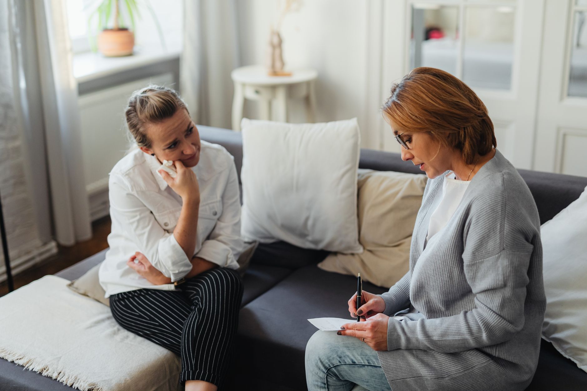 A speech therapist working one-on-one with a client during an in-home session in Sterling, VA