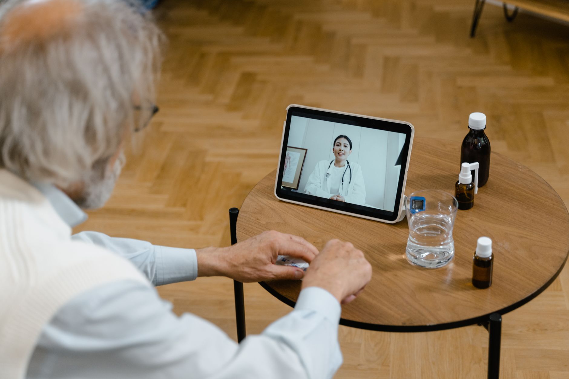 A senior coordinating medications with a physician from home, supported by medication management in Sterling, VA