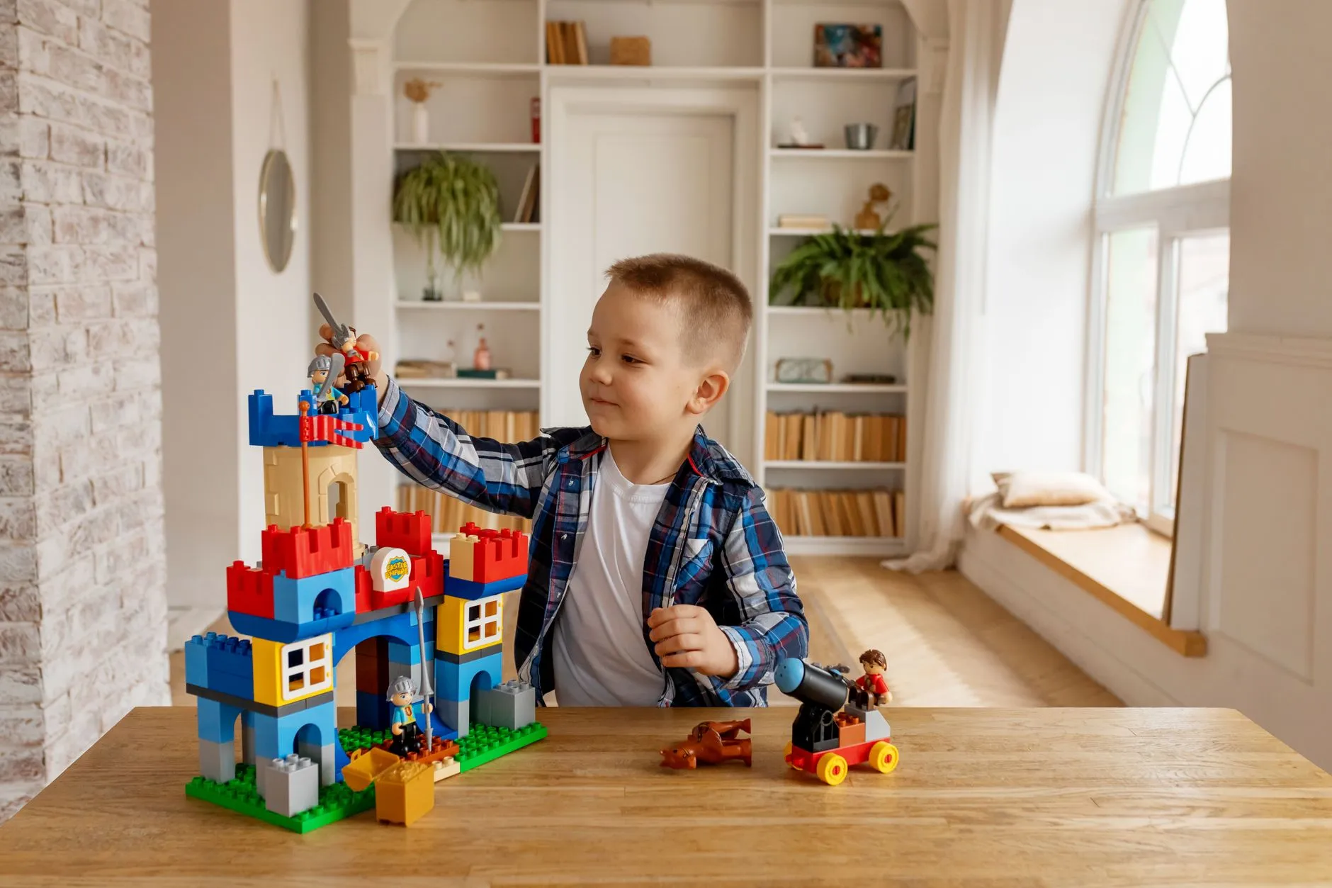Child building with blocks during in-home autism care in Bowie, MD
