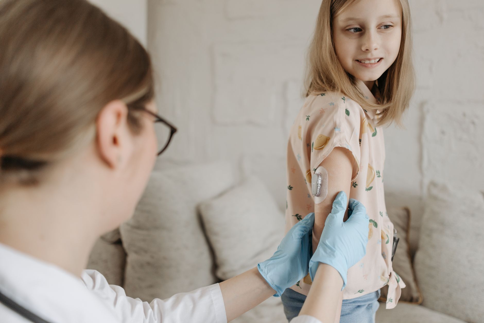 A pediatric nurse providing skilled clinical care for a child with complex needs at home in Sterling, VA