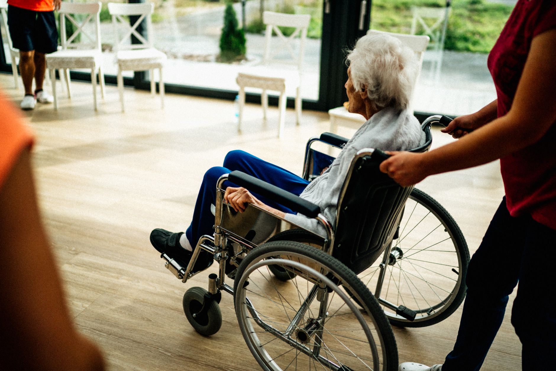 A caregiver providing steady mobility support to a senior during personal home care in Sterling, VA