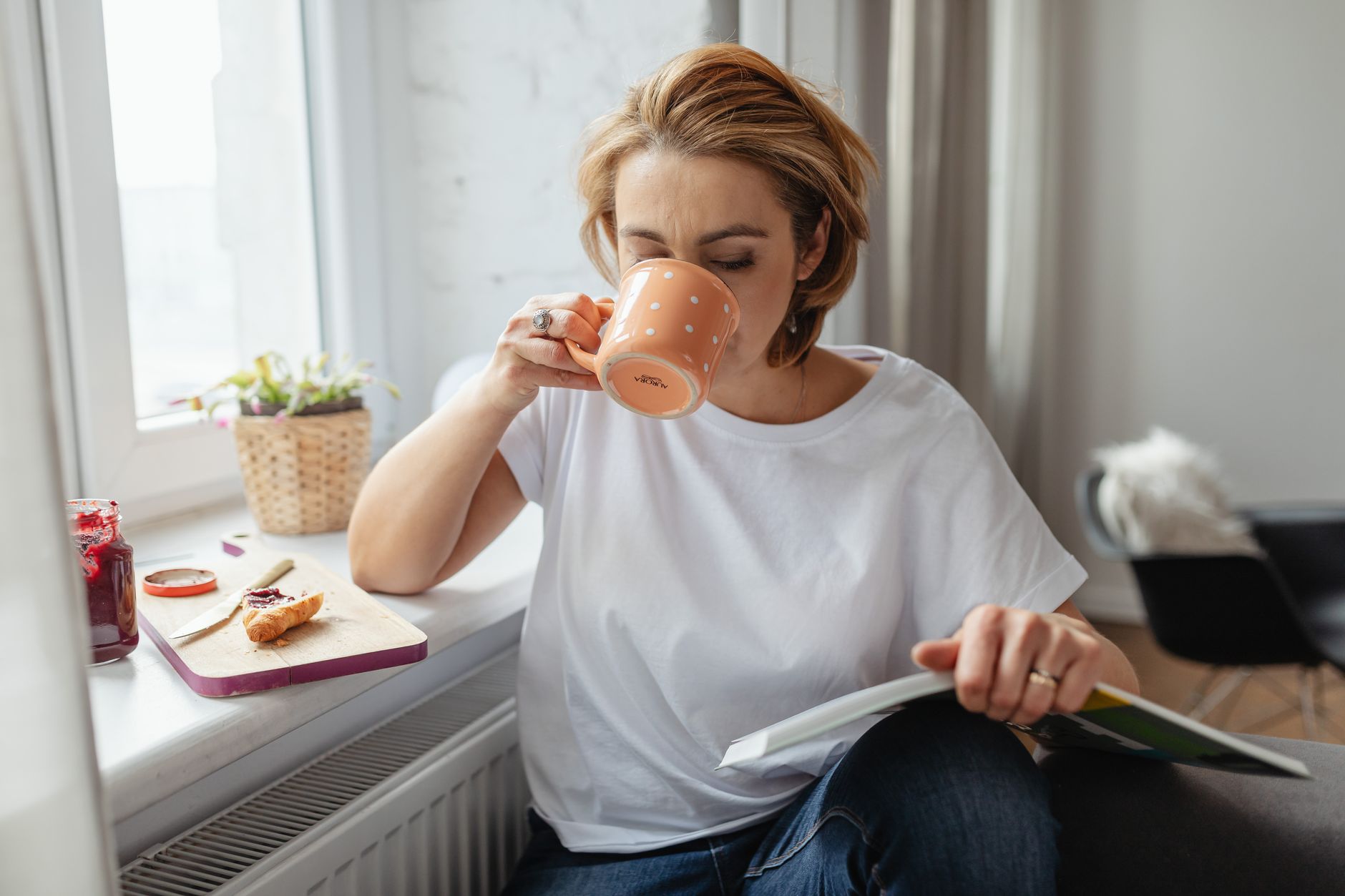 A family caregiver relaxing with coffee during a well-earned respite break in Sterling, VA