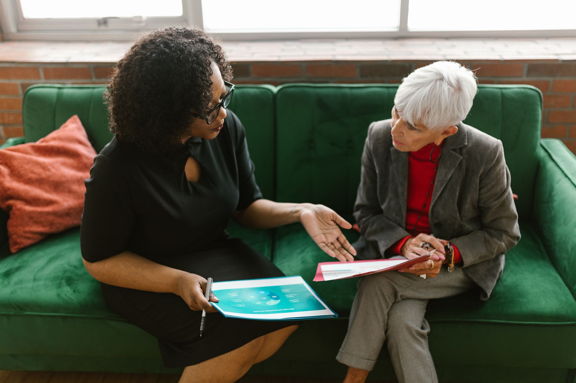 A speech-language pathologist reviewing a personalized care plan with a senior woman in Sterling, VA