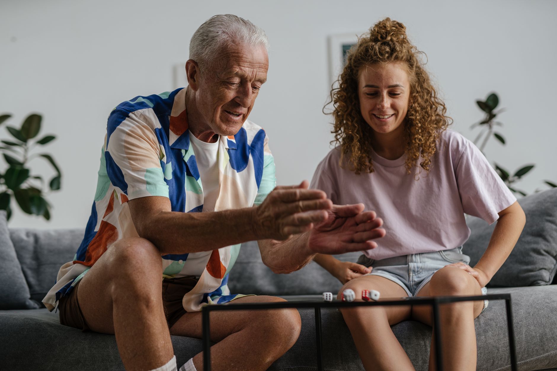 A caregiver sharing a warm, engaged moment with a senior veteran during in-home care in Sterling, VA